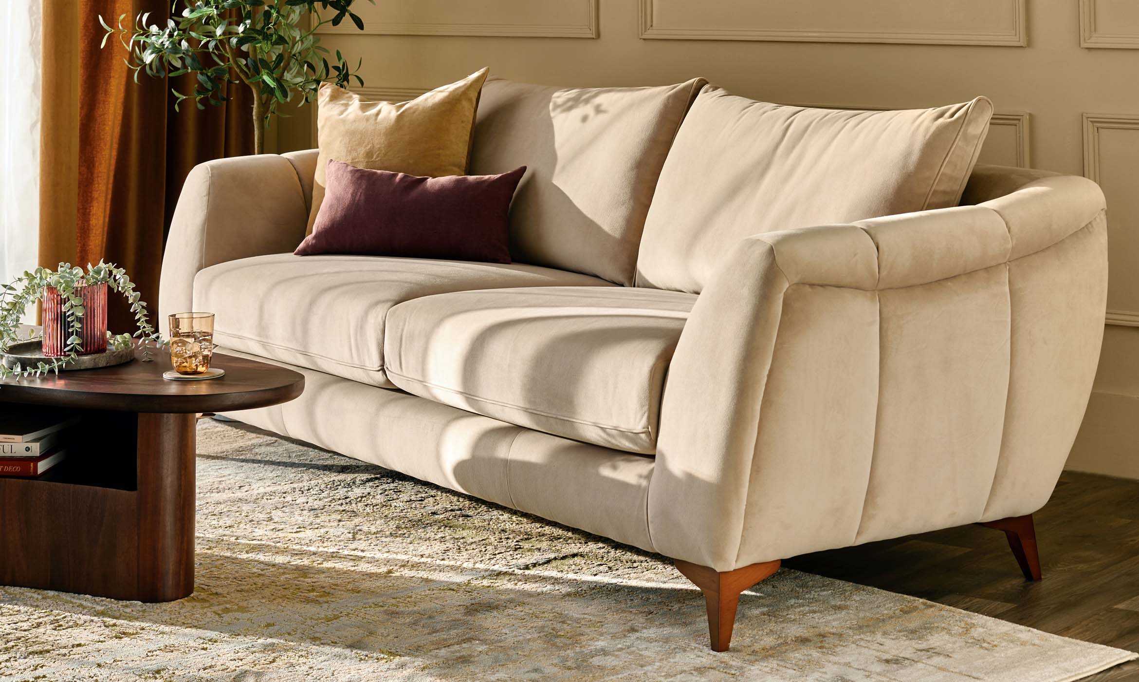 Genevieve champagne velvet 3 seater sofa with wooden leg