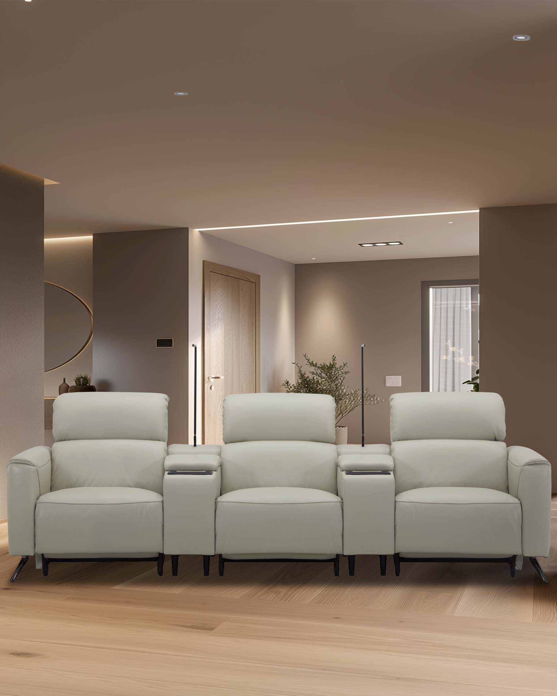 A modern, stylish light-colored leather reclining sofa set featuring three seats with a central armrest and cup holders.