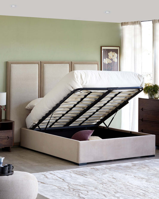 Stylish storage bed with a plush headboard and gas lift mechanism, complemented by a bedside table and decorative rug.