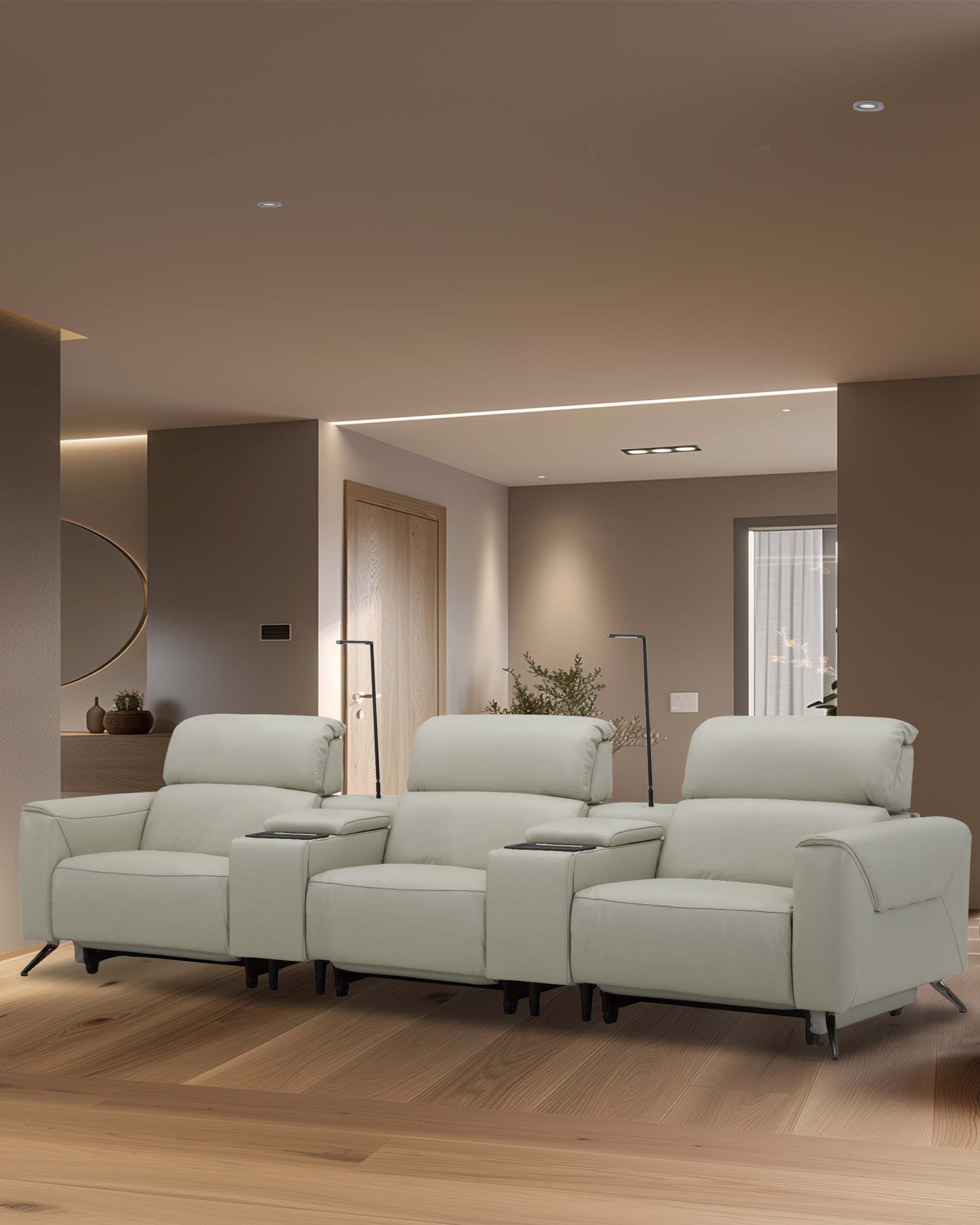 Modern light green reclining sofa with cup holders, featuring plush cushions and sleek lines for a stylish living space.