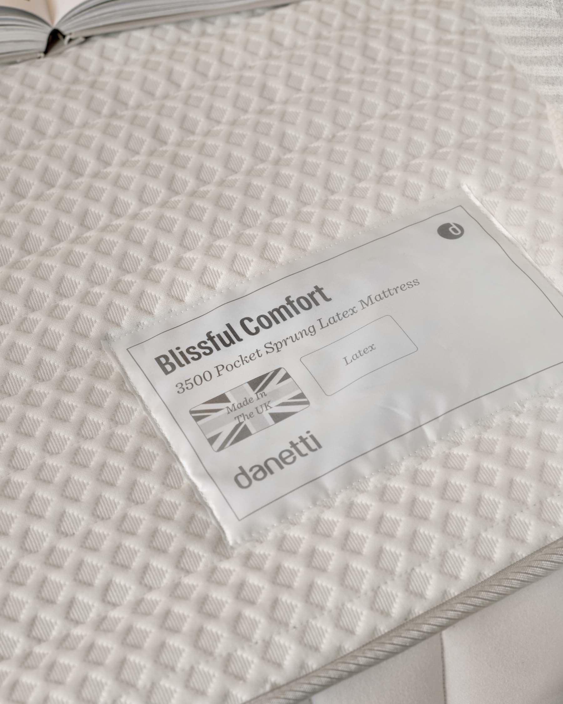 3500 pocket sprung latex mattress with a textured cream cover, labeled "Blissful Comfort," made in the UK by Danetti.