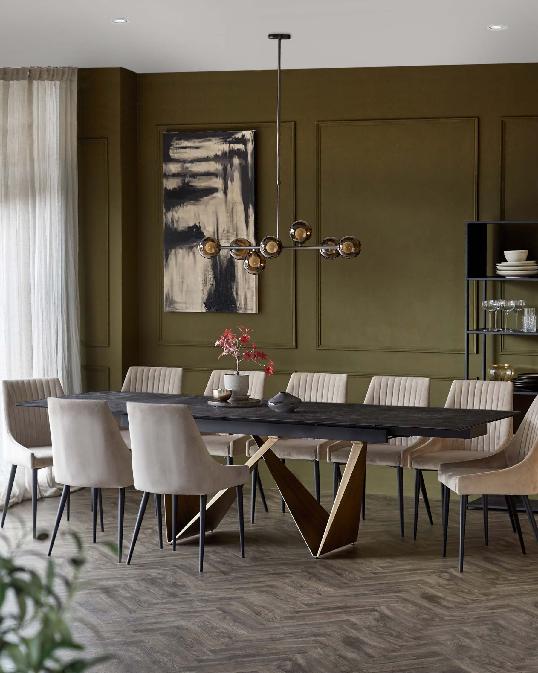 A modern dining set featuring a large dark table with a unique base, complemented by plush beige chairs and a stylish chandelier.