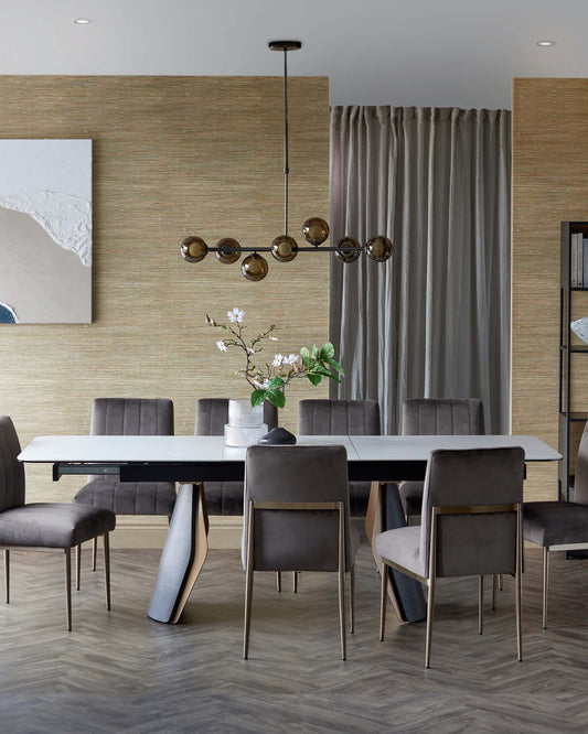 Modern dining table with an extending mechanism, surrounded by elegant velvet chairs and a stylish pendant light overhead.