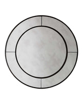 Round marble-top coffee table with a geometric base design, featuring concentric circles and linear accents.