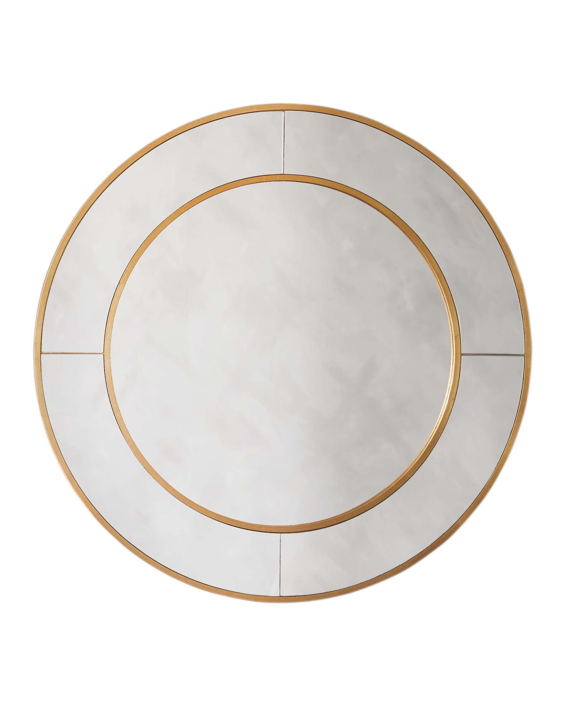 Round wall mirror with a segmented design featuring gold trim accents.