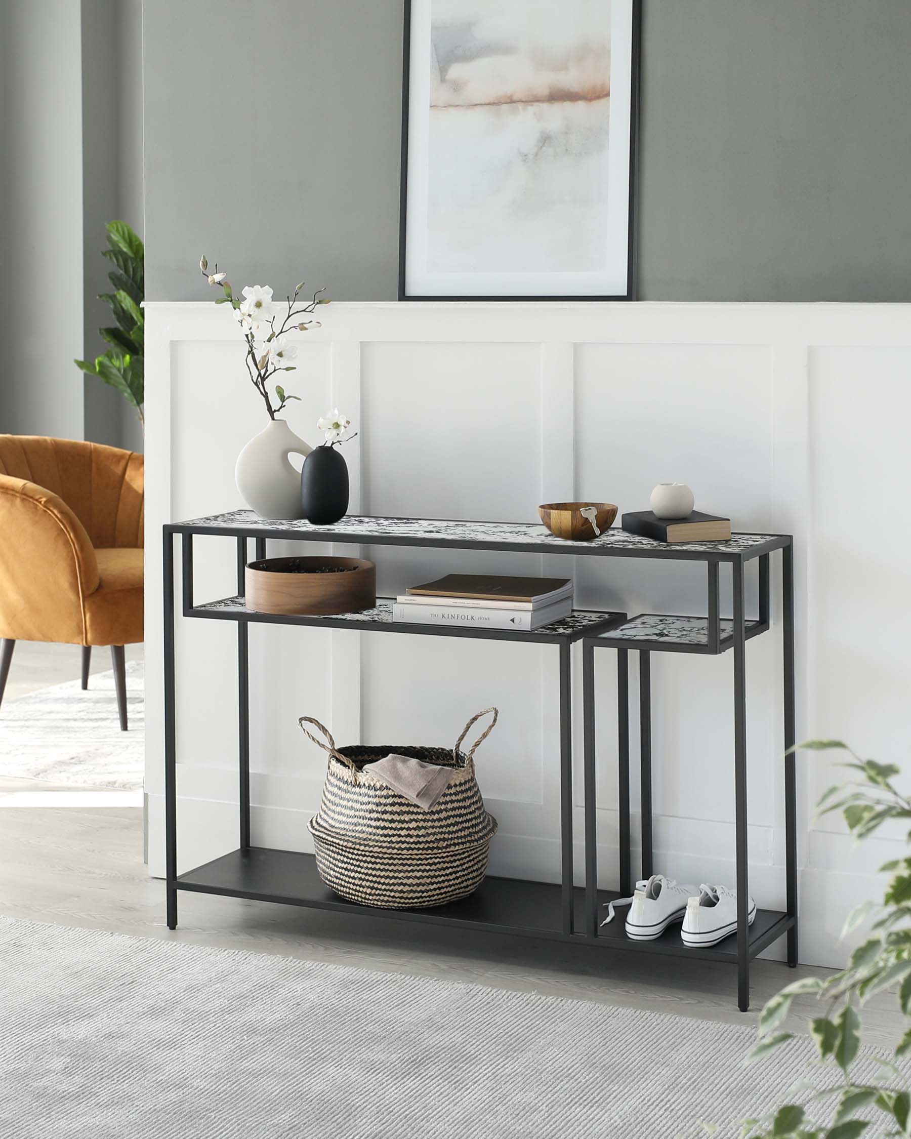 A sleek console table with a marble top, decorative vases, a wooden bowl, a storage basket, and stylish sneakers beneath.