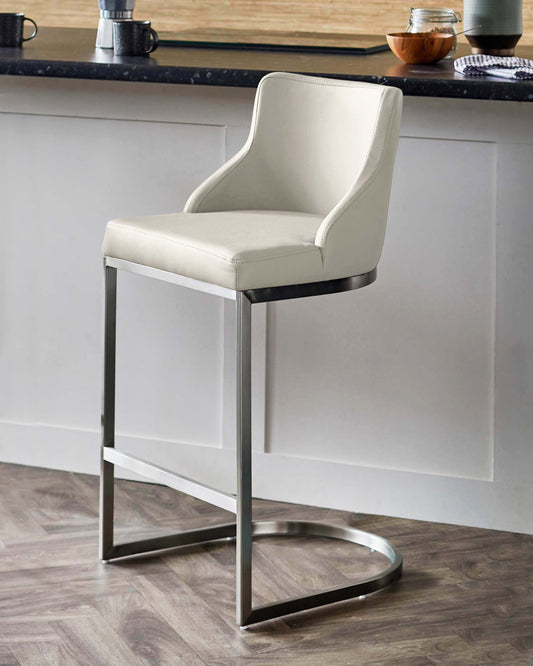 Modern cream-colored bar stool with sleek metal legs and armrests, perfect for contemporary kitchen or dining spaces.