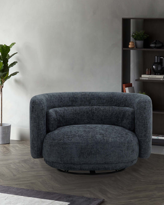 A plush, round, dark green armchair with curved arms, set against a neutral wall, complemented by a sleek shelf and a plant.