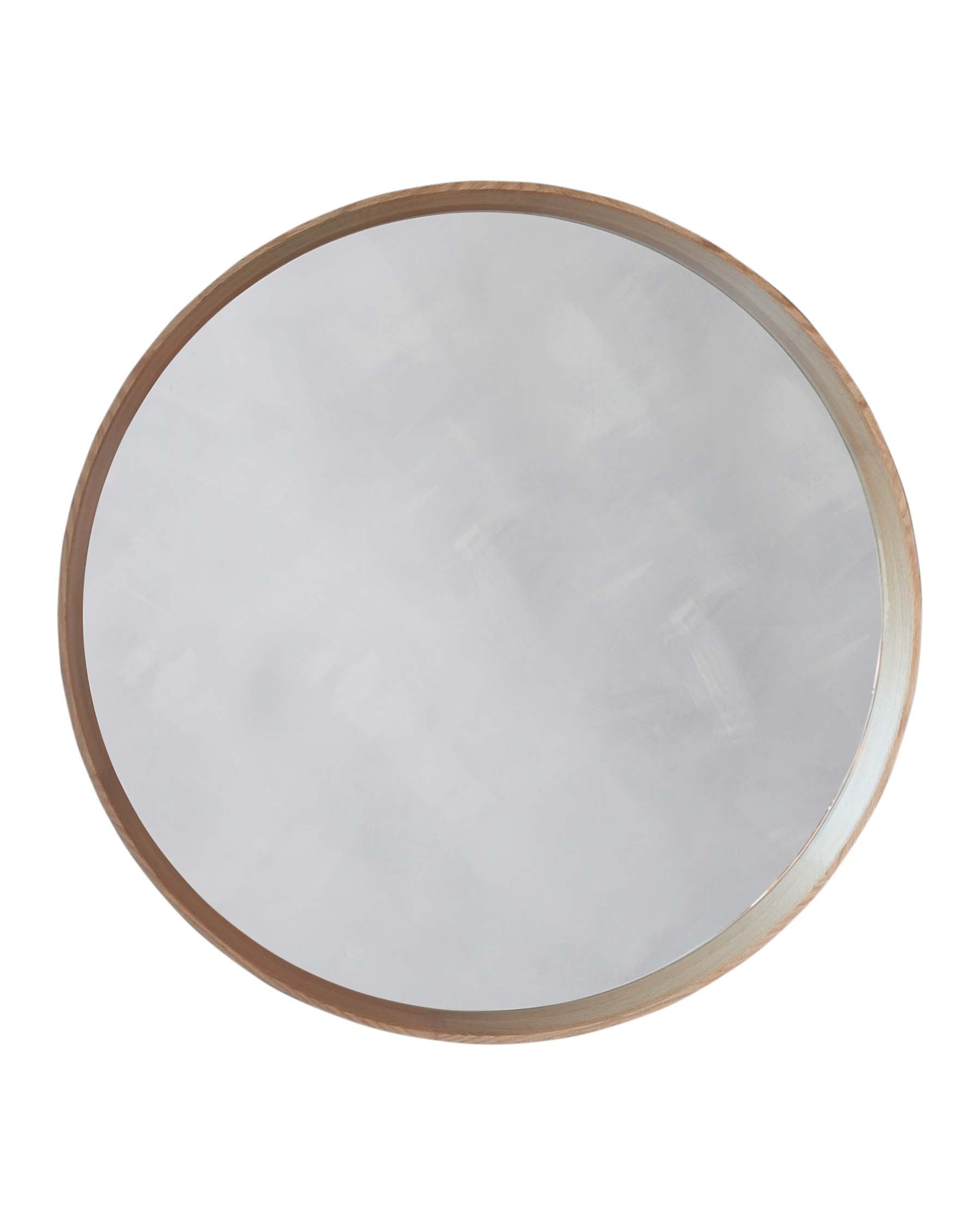 Round wall mirror with a thin, natural wooden frame on a blank background.