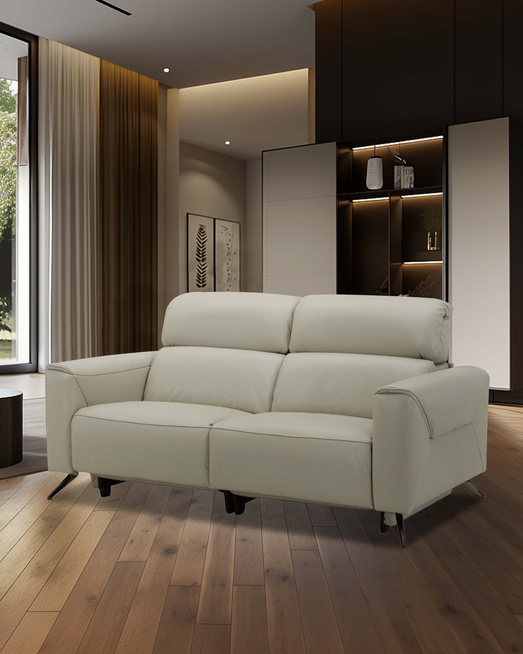 Modern light gray leather sofa with sleek design and chrome legs, set against a stylish interior backdrop.