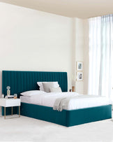 Modern teal upholstered bed with a tall, ribbed headboard and white bedding, accompanied by a sleek nightstand.