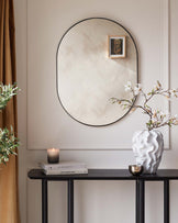 Elegant narrow console table with a dark wood finish and slim, straight legs.