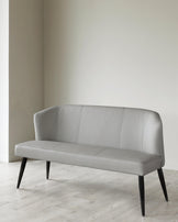 Stylish gray upholstered sofa with curved back and sleek black legs, perfect for modern interiors.