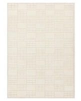 Cream-colored area rug with a textured geometric block pattern and fringe on the shorter edges.