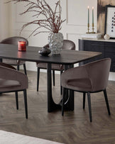 A contemporary dark wood dining table featuring a minimalist design with straight, sturdy legs and a textured tabletop. Paired with the table are elegant, upholstered dining chairs in a rich taupe colour, with smooth, curved backrests and black wooden legs that complement the table. A small, modern sideboard with a textured facade and minimalist hardware rests in the background.