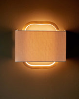 Sanza natural linen and brushed bronze wall light