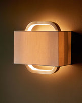 Sanza natural linen and brushed bronze wall light