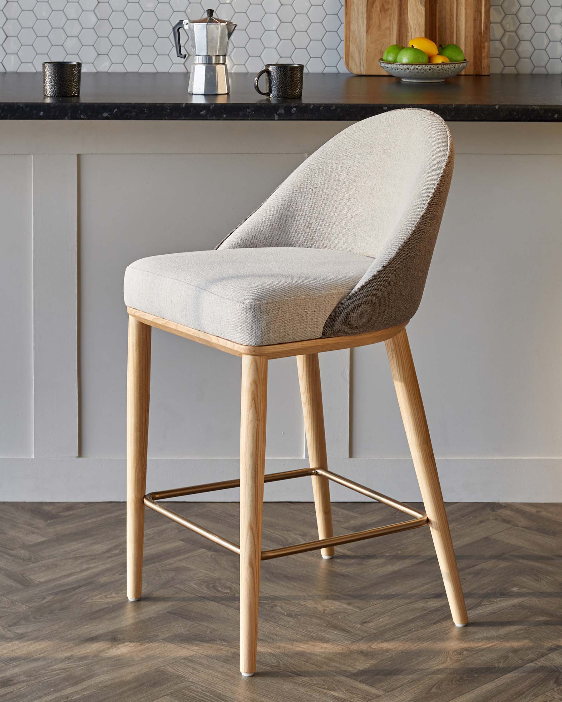 Modern upholstered bar stool with a light wood frame, featuring a comfortable curved back and a sleek design.