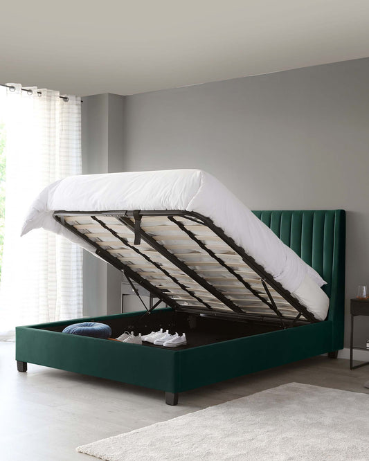 Elegant emerald green upholstered storage bed with vertical channel tufting on the headboard, featuring a gas lift mechanism that reveals a spacious under-bed storage compartment.