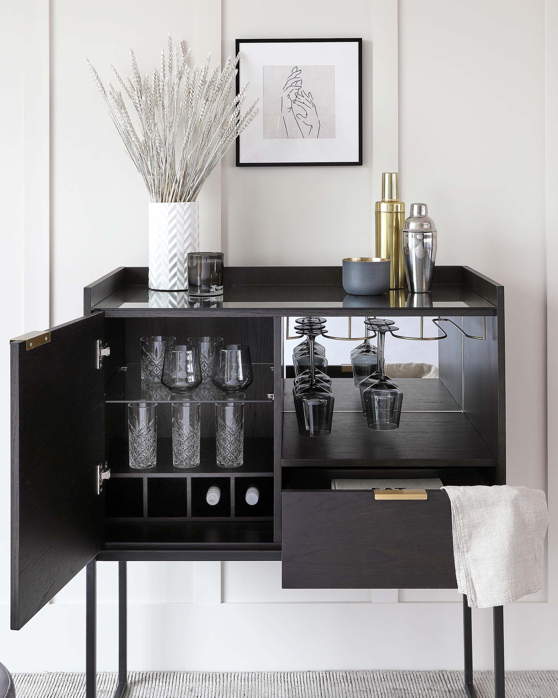 Elegant contemporary bar cabinet in a dark wood finish with gold-tone handles, featuring a spacious top surface, open shelving with glassware storage, a drawer, and wine bottle compartments, raised on slender legs.