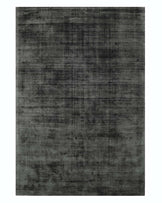 Luxurious modern grey area rug with an elegant weathered design, suitable for contemporary home decor.