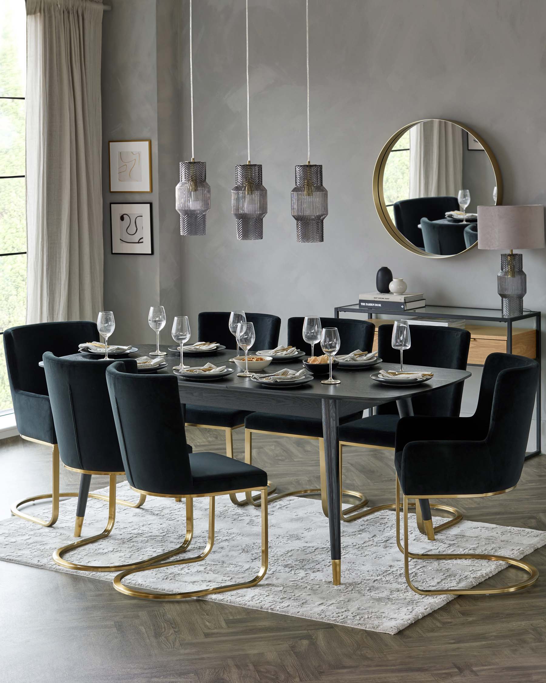 A modern dining room set featuring a sleek, black tabletop with a rectangular shape, supported by solid legs at each end. A set of six elegant dining chairs with black velvet upholstery and unique curved gold metal legs complement the table. The set is arranged on a textured off-white area rug, designed to enhance the room's contemporary aesthetic.