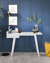 A sleek, white modern console table with clean lines and a minimalist design, featuring an angular profile and a single drawer for storage.