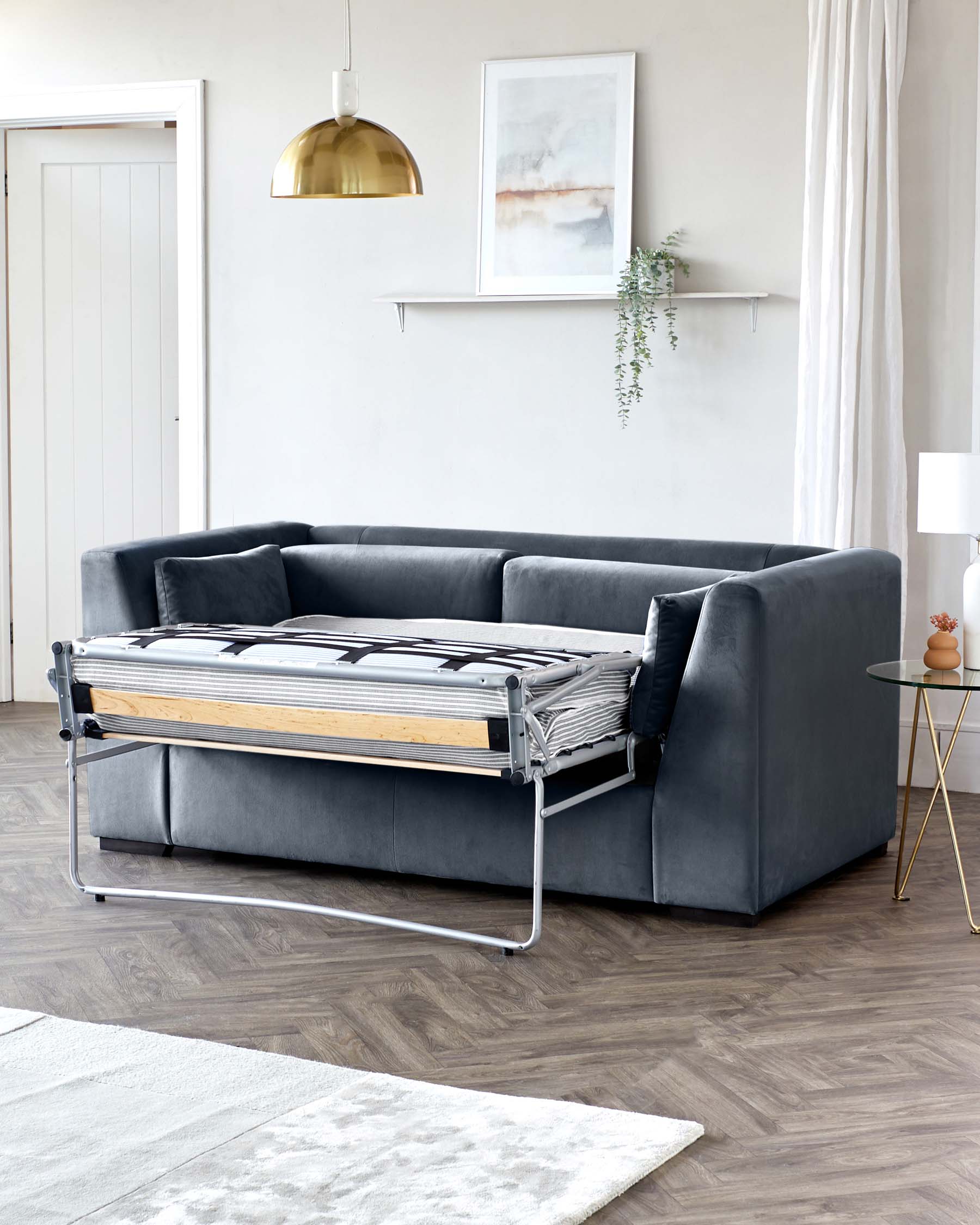 Modern charcoal grey sofa bed with a pull-out metal frame and wooden slats partially extended, showcasing the sofa's dual functionality in a contemporary living room setting.