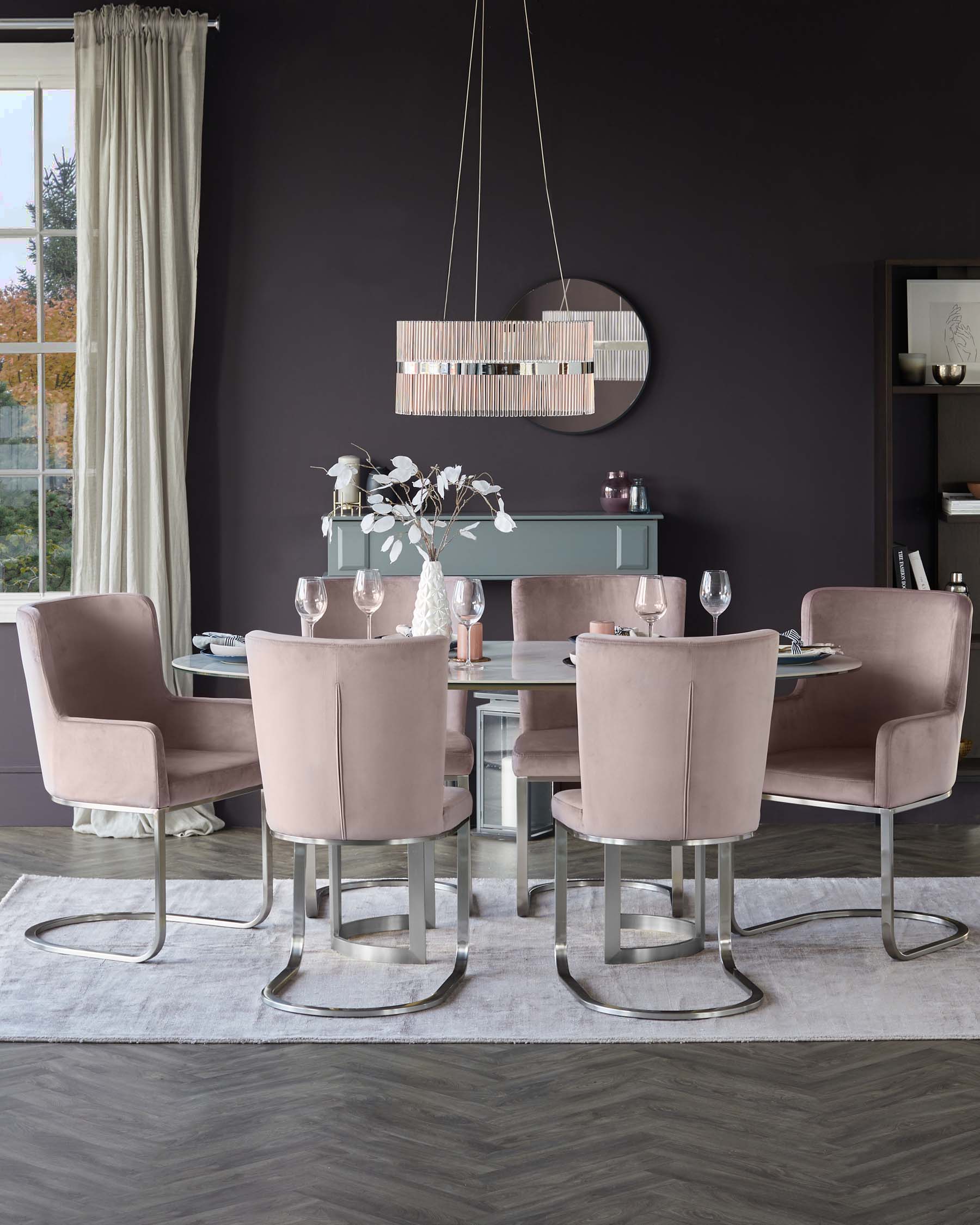 Modern dining room featuring a round, clear glass table with a unique, flared central pedestal base in a polished metal finish. Surrounded by six plush velvet-upholstered armchairs with curved backs and metal cantilever bases that provide a floating effect. The serene colour palette consists of soft pinks and muted greys, complemented by the room's sleek metallic and glass accents for a luxurious contemporary look.