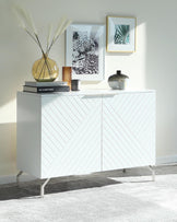 Modern white sideboard with chevron-patterned doors and sleek metal legs.