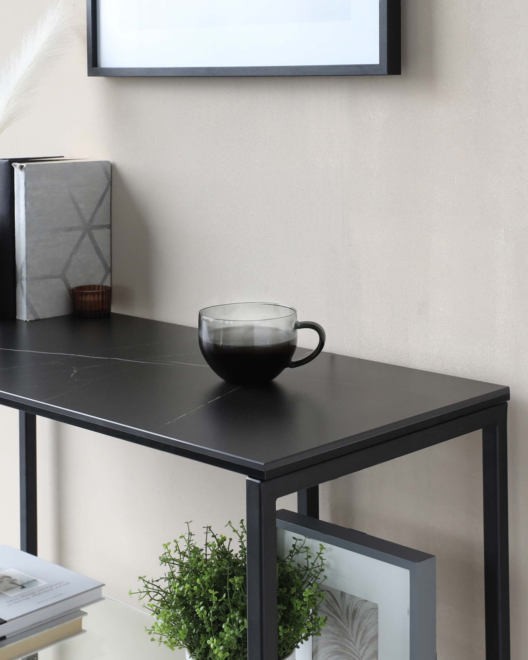 Modern black rectangular console table with sleek metal frame and a smooth tabletop, ideal for minimalist or contemporary decor.