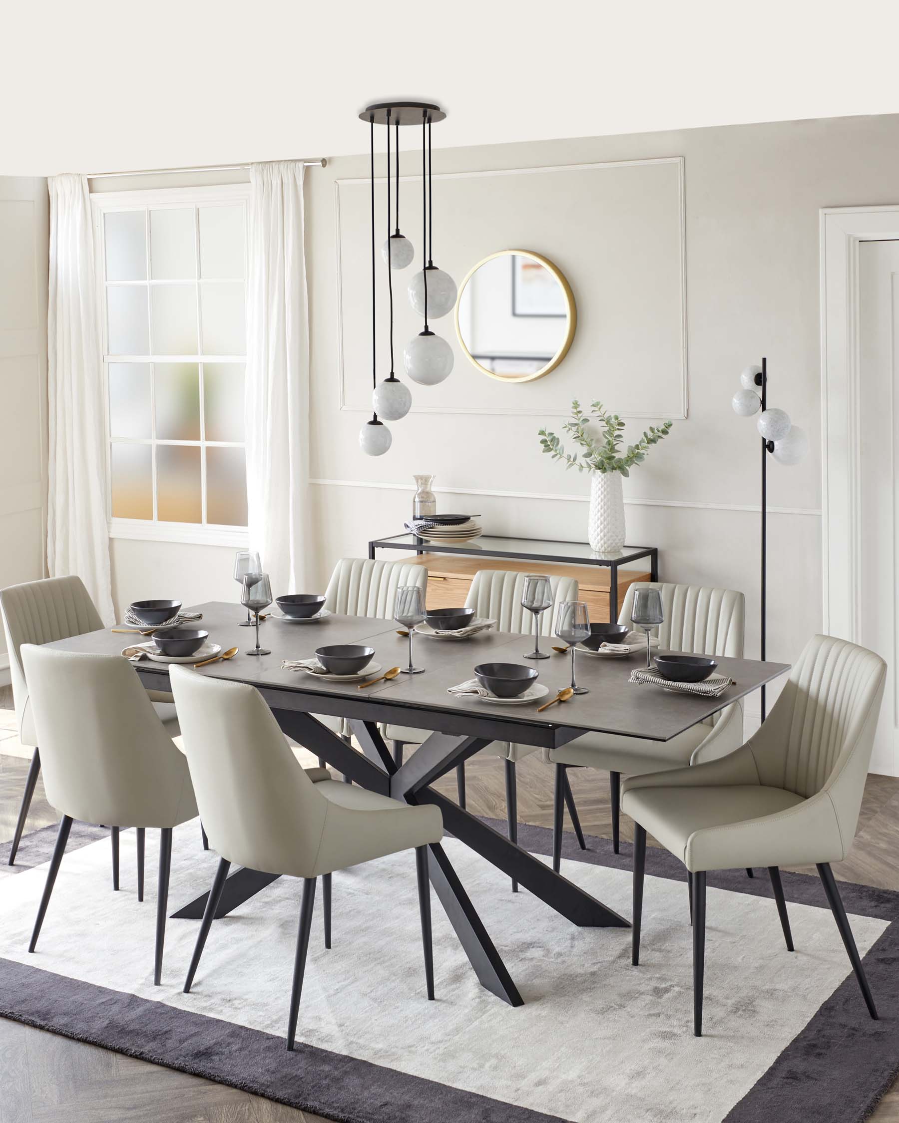 Modern dining set featuring a sleek table, upholstered chairs, stylish pendant lights, and minimalistic decor.