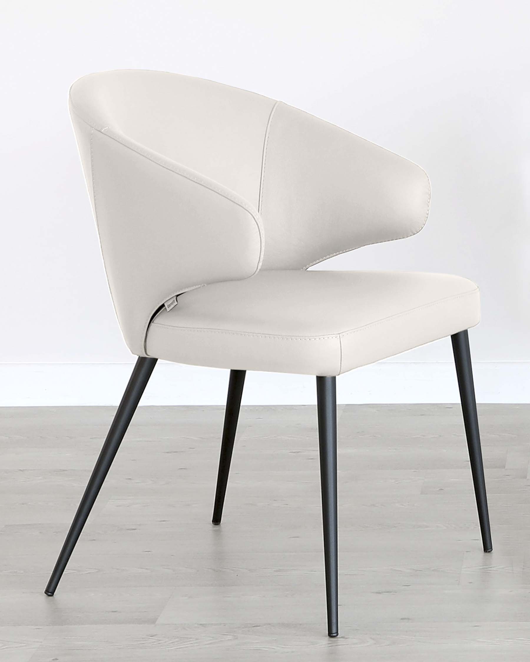 Modern light grey upholstered dining chair with a curved backrest and four angled metal legs in a dark finish, displayed against a white background with a light wooden floor.