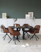 A modern dining set with a rectangular dark wood table and four brown leather chairs with black metal legs. The table is styled with simple place settings, a small plant, and wine glasses. A beige and grey area rug underlays the set.