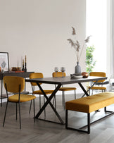 Modern dining room furniture set with a rectangular dark wood table with black X-shaped legs, a matching bench with a cushioned mustard yellow top and black metal legs, and four mustard yellow upholstered chairs with sleek black metal legs.