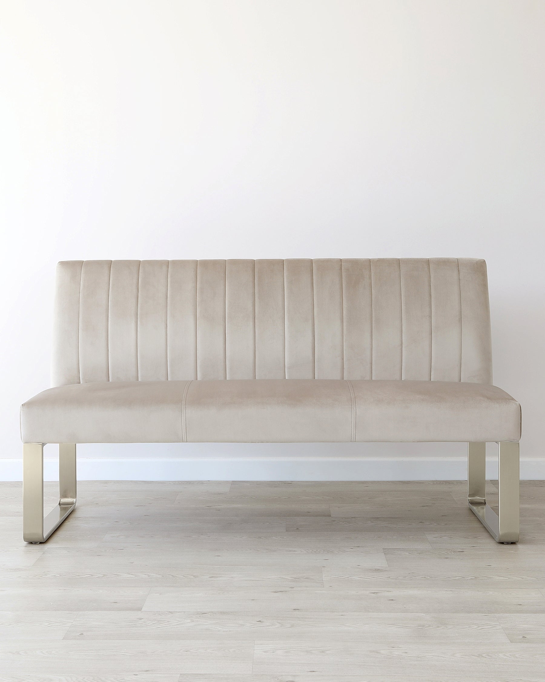 Elegant beige velvet bench with horizontal stitching and sleek metal legs, perfect for modern interiors.