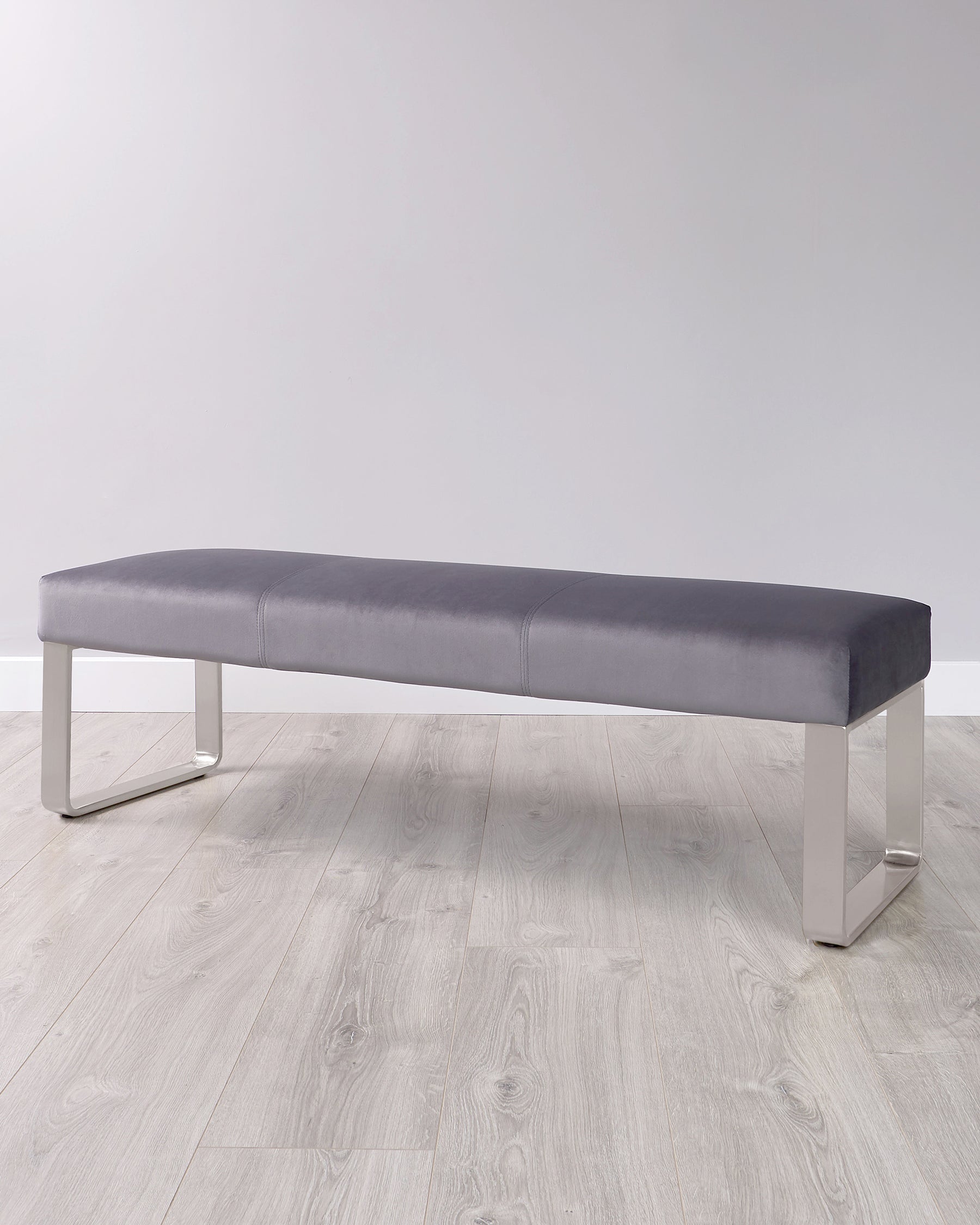 Modern gray upholstered bench with sleek metallic legs, ideal for minimalist decor and versatile seating solutions.