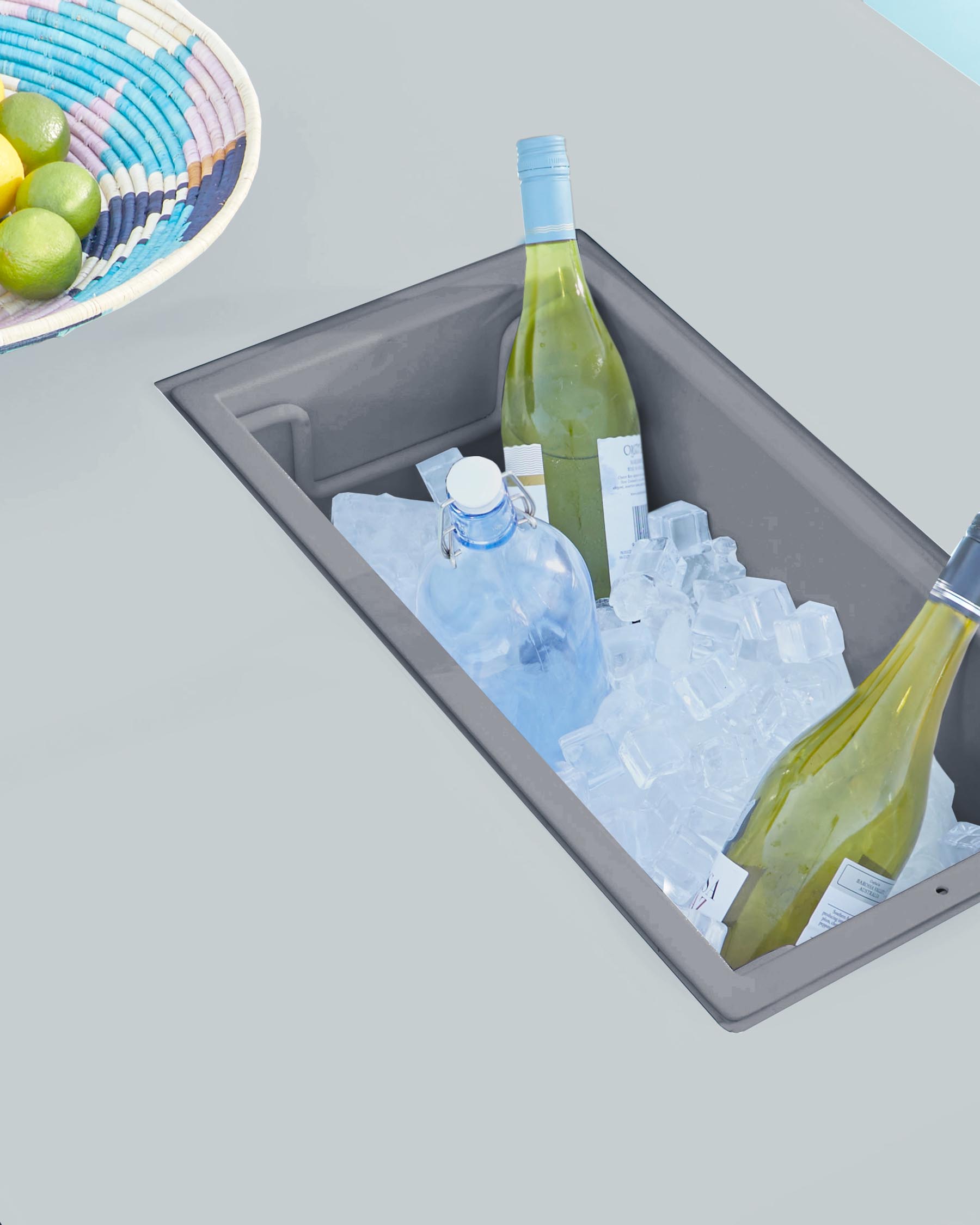 Modern outdoor furniture featuring a built-in ice bucket compartment, with clean lines and a minimalist grey design.