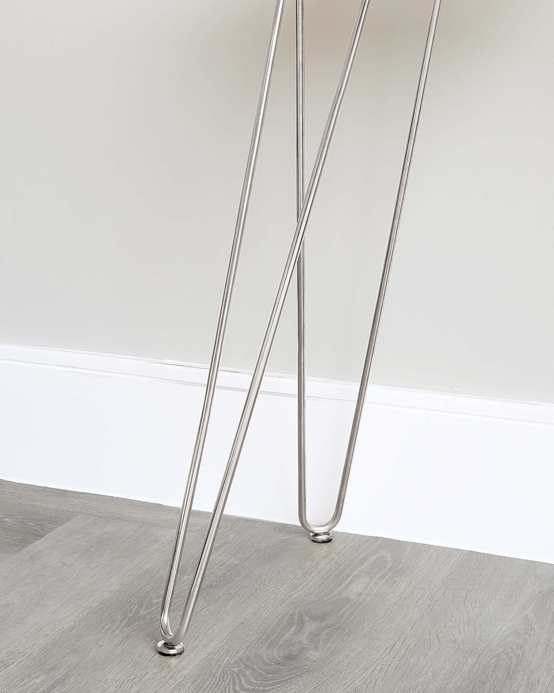 Modern chrome-plated table legs in an X-shape design, showcasing sleek lines and a polished finish, suitable for contemporary interior decors.